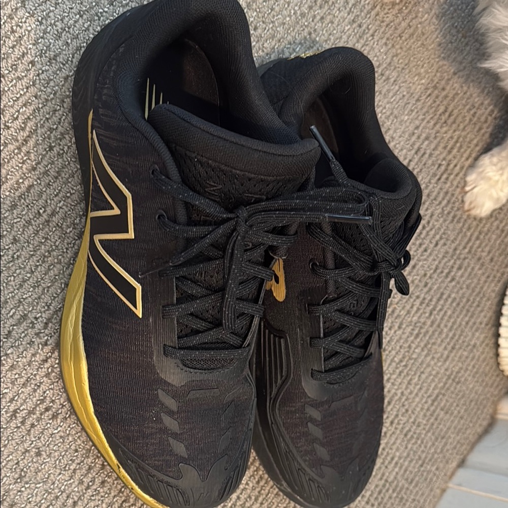 New Balance Black and Gold Athletic Shoes